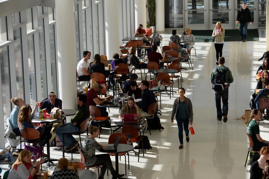 Aerial view of students sitting at tables.