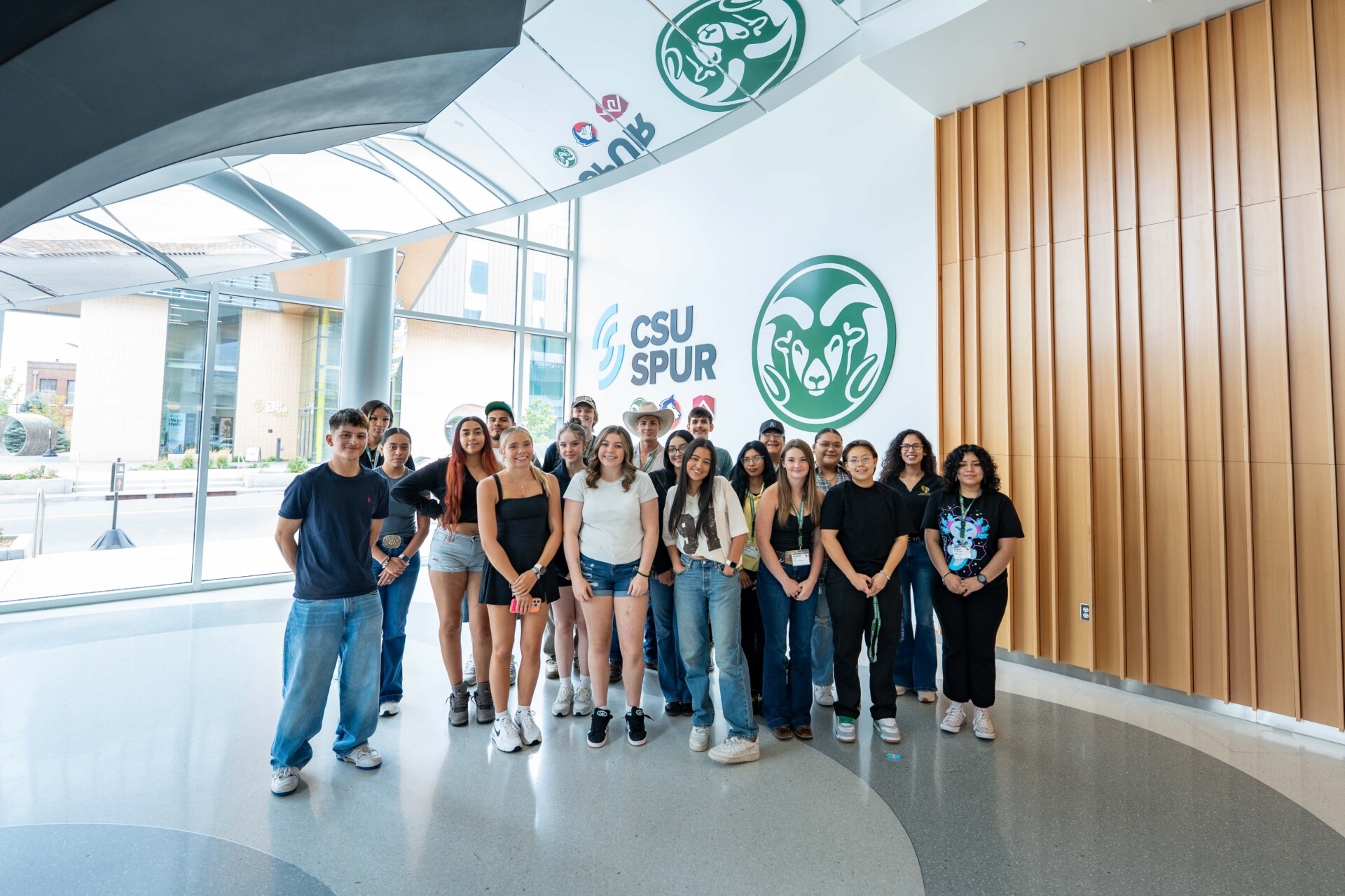 Group photo in front of a CSU Spur sign.
